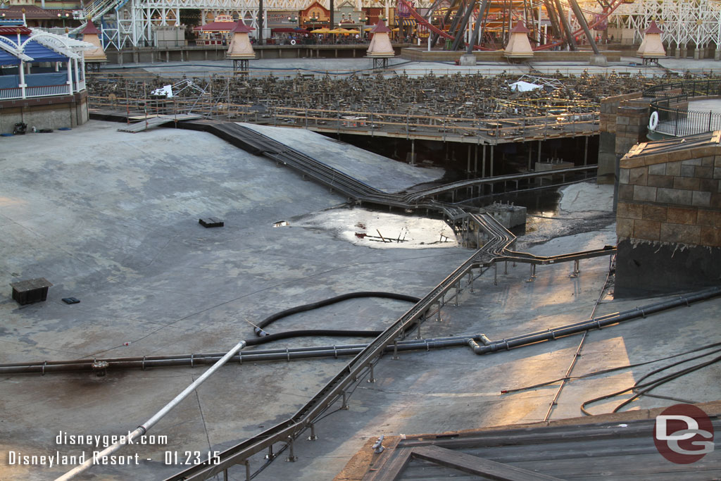 Some of the hoses on the far right and in the middle appear to be what they are using to wash down and suck up the muck.