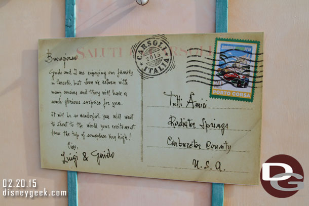 A hint at the backstory of the new attraction in this post card on the construction wall.