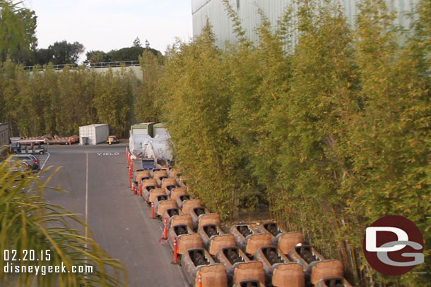 A quick look backstage from the Monorail.  Splash Mountain logs stored along side the  Indy showbuilding.  More interesting is in the back covered up are Peter Pan ride vehicles hard to tell with this pic since I had the wrong lens..