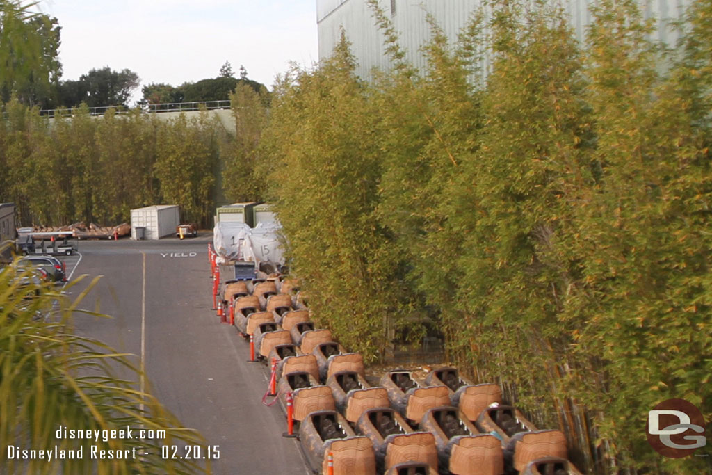 A quick look backstage from the Monorail.  Splash Mountain logs stored along side the  Indy showbuilding.  More interesting is in the back covered up are Peter Pan ride vehicles hard to tell with this pic since I had the wrong lens..