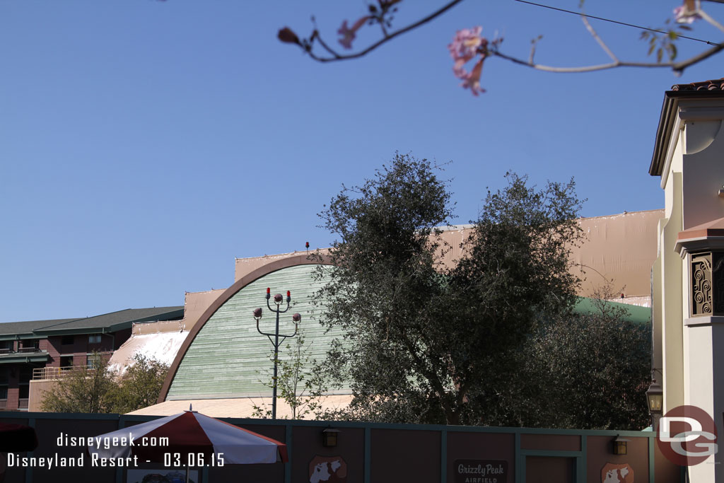 The former Taste Pilots Grill has a new wood/worn look and a new wood awning is visible.