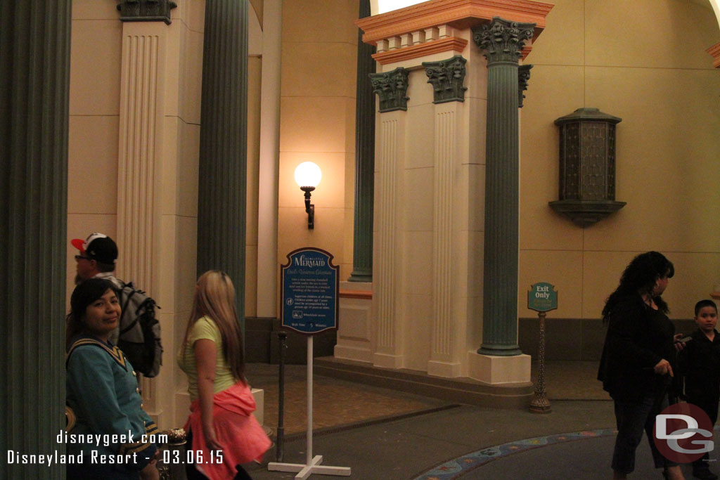 The Little Mermaid greeter and wait sign have been moved to under the rotunda.  Wonder if a more permanent sign is in the works for both the entrance and exit.