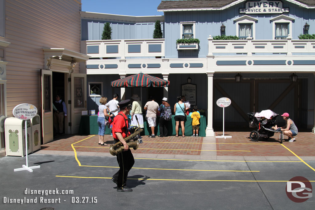 You can redeem your map at any point and pick your prize.  They have a queue set up near the parade gate on Main Street.