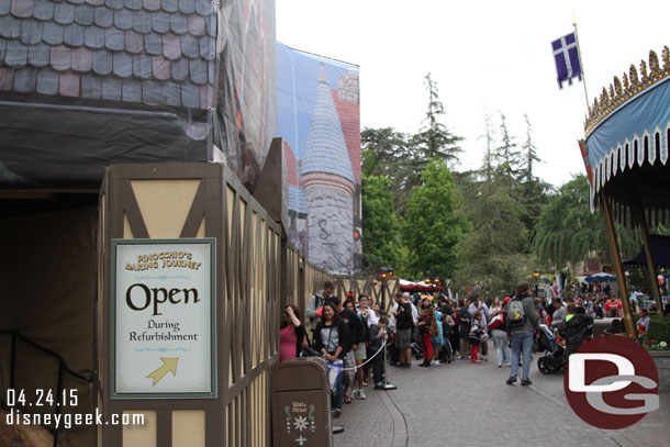 The attraction remained open and the line stretched out into Fantasyland.  Not sure how much of the queue was open inside.