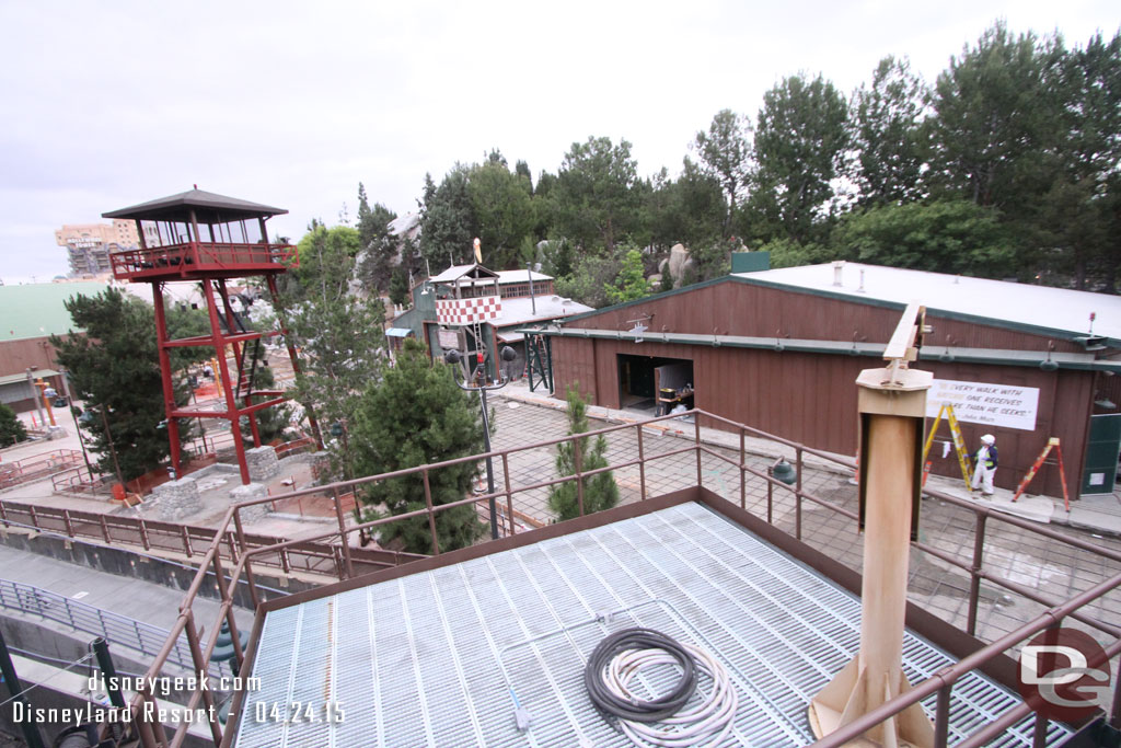 A new sign being painted on the restroom building.  