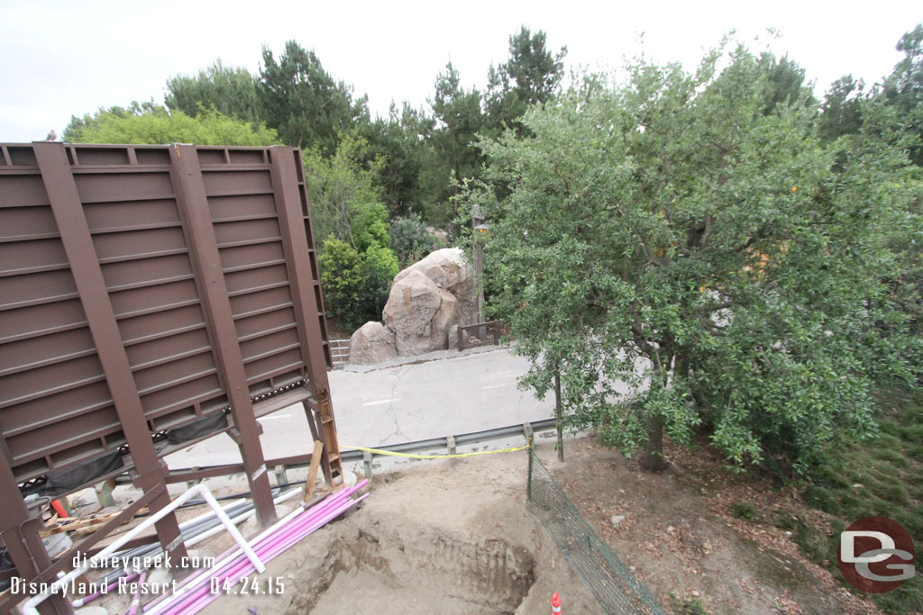 A large hole behind the billboard.  Guessing for a tree.