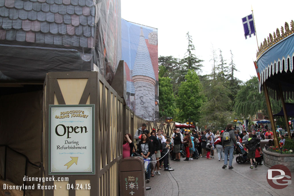 The attraction remained open and the line stretched out into Fantasyland.  Not sure how much of the queue was open inside.