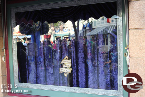 Outside the Emporium Windows still have curtains up.