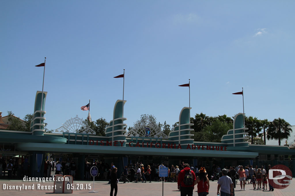 A look at the Disney California Adventure entrance.  The Diamond Anniversary decorations are partially installed.  The left and center are up but not the right one yet over the letters.