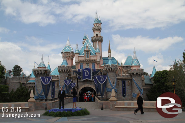 Characters and representatives of the cast stream out from the castle