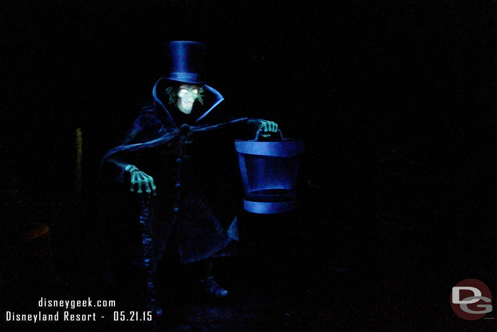 The Hatbox Ghost has rematerialized inside the Haunted Mansion.  He is as you exit the attic right before descending to the graveyard.  
Here is my first attempt at capturing the Hatbox Ghost.