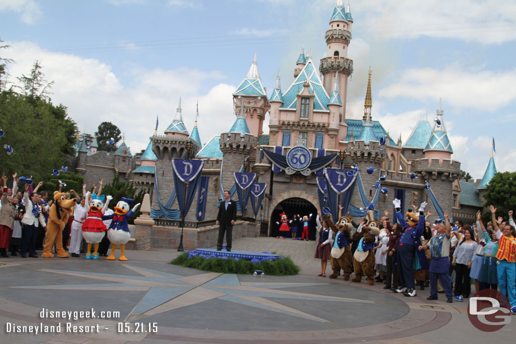 The cast throws their hats in the air.