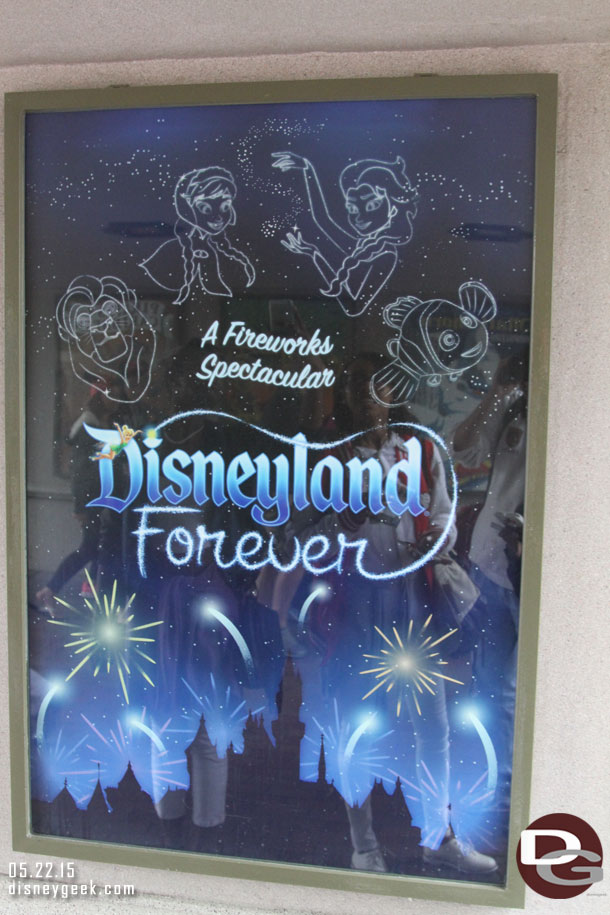 The attraction poster for Disneyland Forever is up in the tunnel under the train tracks.