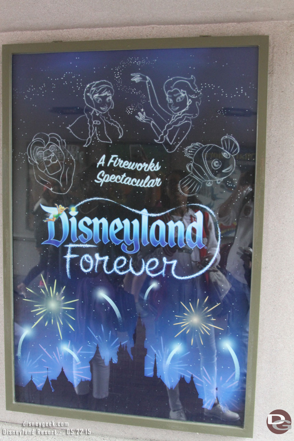 The attraction poster for Disneyland Forever is up in the tunnel under the train tracks.