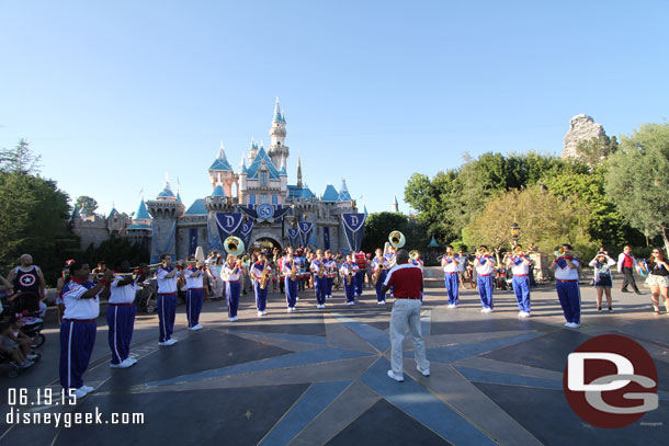 The All-American College Band performing in front of Sleeping Beauty Castle at 6:15pm