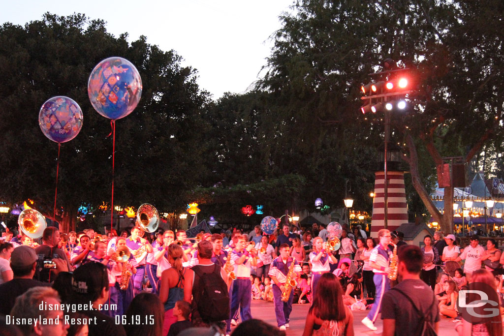 The band moves down the parade route and stops just short of the Fantasyland walkway and performs Let it Go.