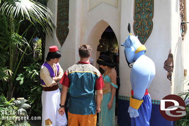 Passing through Adventureland, Aladdin, Jasmine and Genie were out greeting guests  In this case they were watching the guest do something..