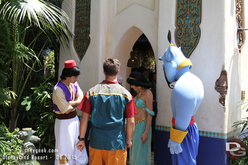 Passing through Adventureland, Aladdin, Jasmine and Genie were out greeting guests  In this case they were watching the guest do something..