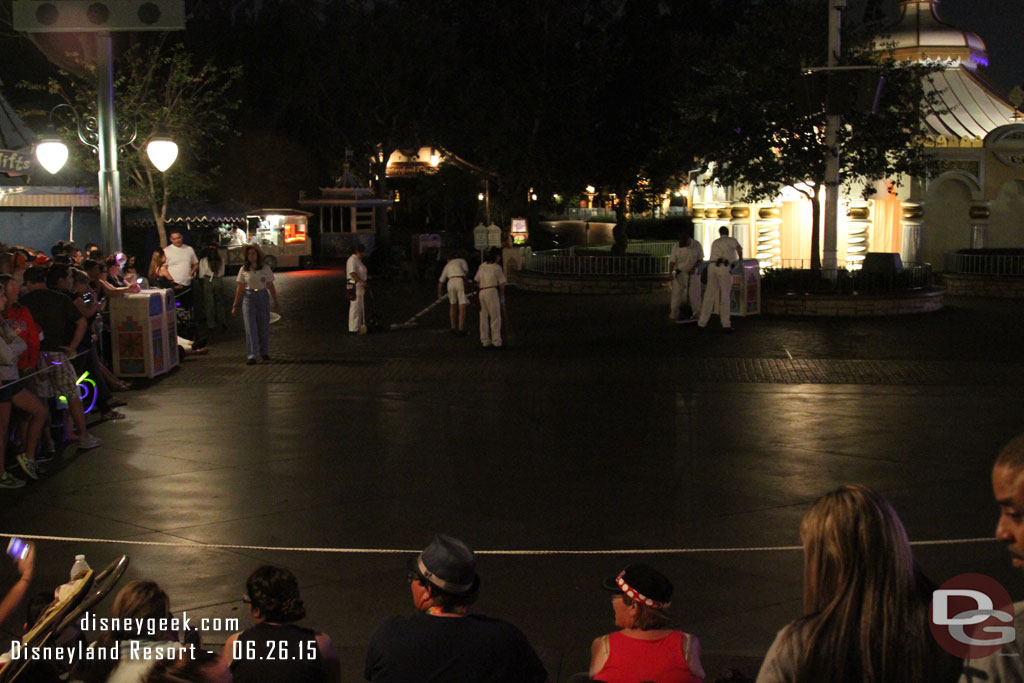 Custodial cast members were cleaning up the area after the parade guests were moved back.