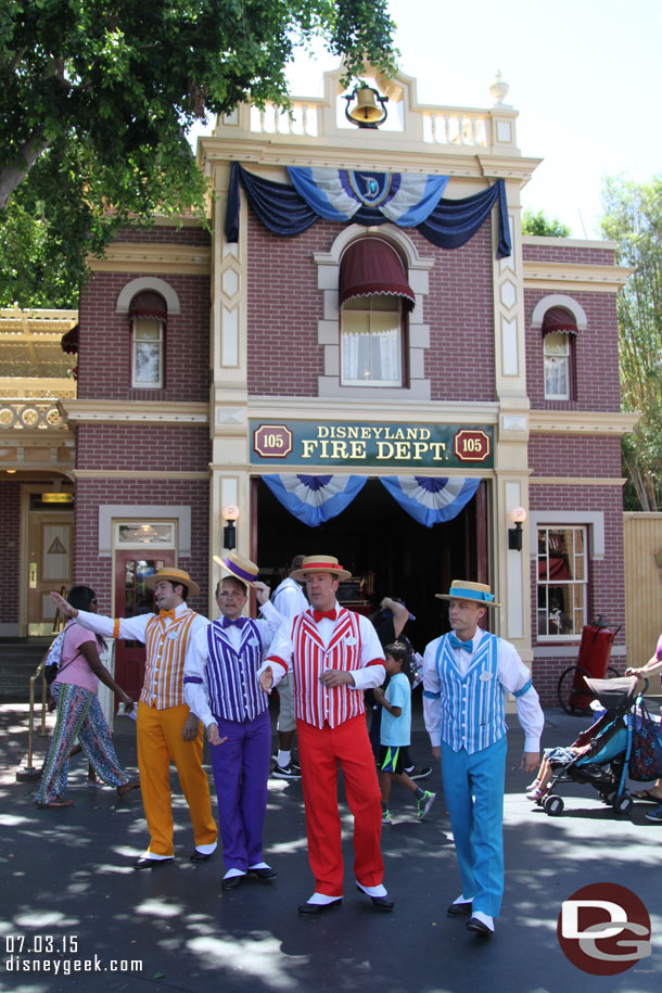 The Dapper Dans of Disneyland in Town Square.  Surprised they were not wearing their red, white and blue this year.