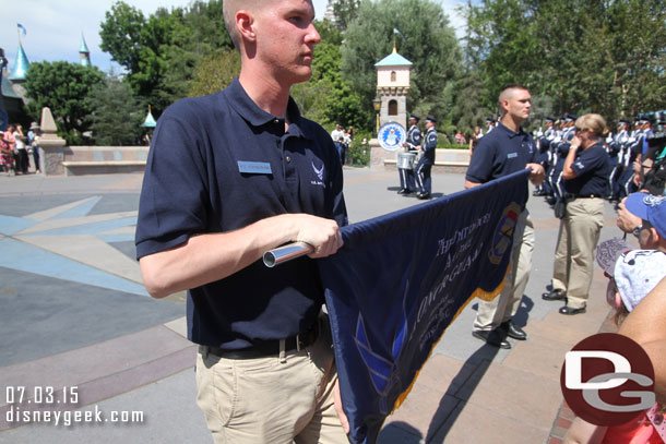 I thought this was odd staging.  The two holding the banner stood right at show center the entire time blocking the view and so close to guests you could not get a picture of it really.