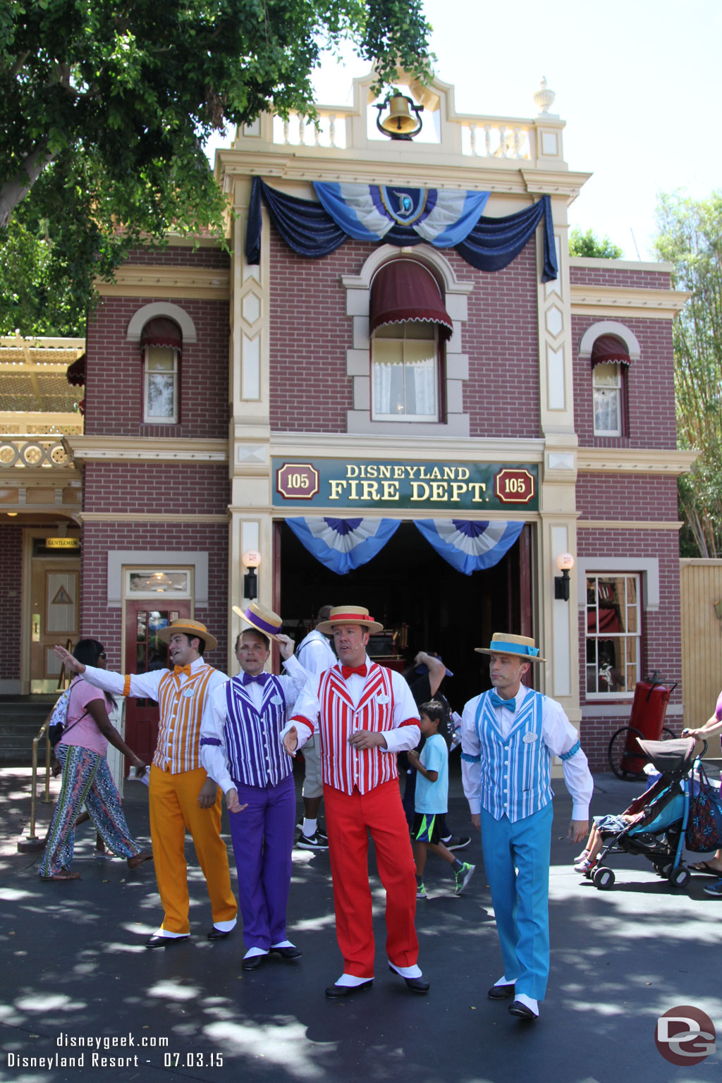 The Dapper Dans of Disneyland in Town Square.  Surprised they were not wearing their red, white and blue this year.