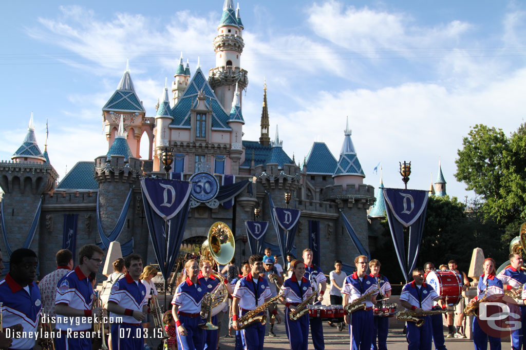 The All-American College Band performing in front of Sleeping Beauty Castle