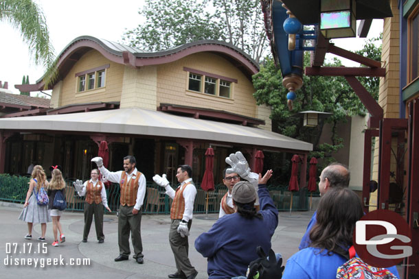 More cast members along the walkway.