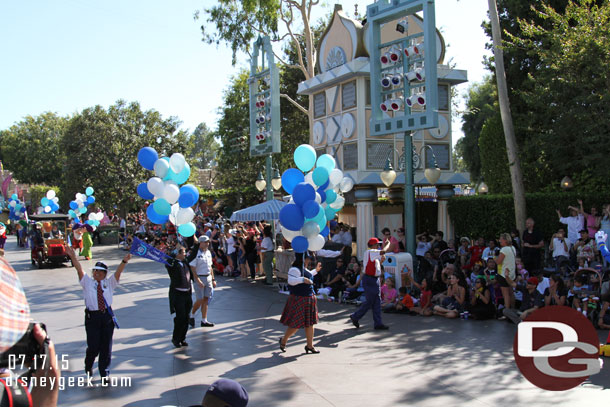 Cast Members representing the current cast in between the cars.