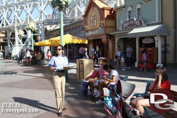 More cast members walking Paradise Pier handing out cupcakes to guests.  They also walked the queue for Toy Story.