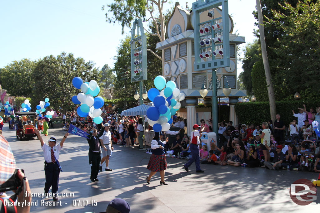 Cast Members representing the current cast in between the cars.