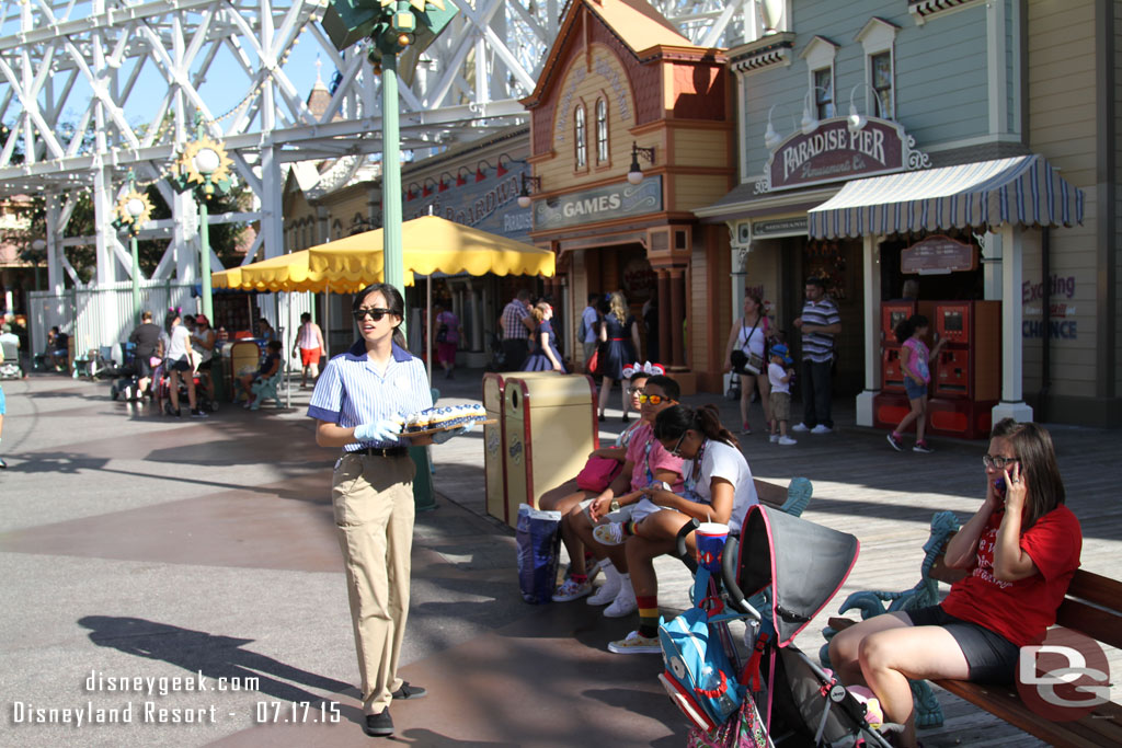 More cast members walking Paradise Pier handing out cupcakes to guests.  They also walked the queue for Toy Story.