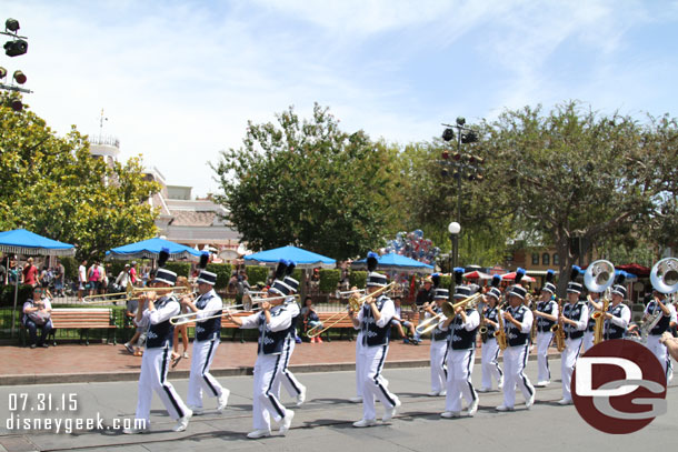 The Disneyland Band marching through the hub playing the theme from Indiana Jones