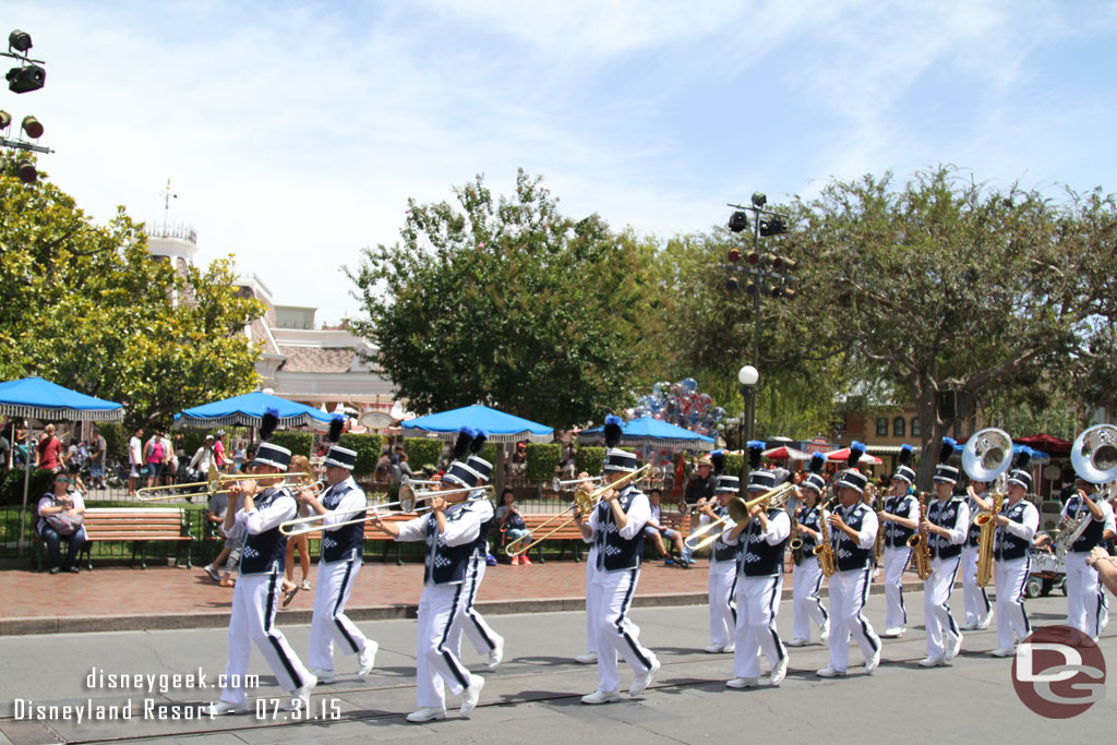 The Disneyland Band marching through the hub playing the theme from Indiana Jones