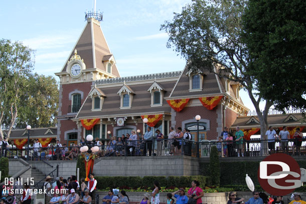 Cast members and guests watching the Flag Retreat