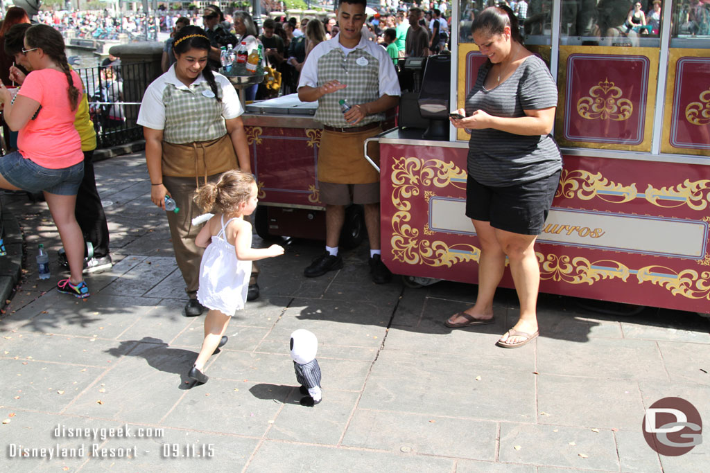 A child playing with a jack doll.. looked like it was being controlled by cell phone.