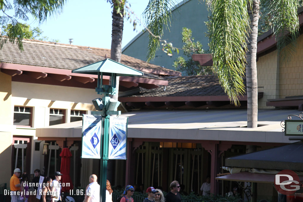 Downtown Disney has Disneyland 60th Banners up still.  Wonder if Christmas will be coming or if they will stay 60th.