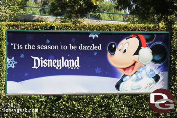 The Mickey and Friends Tram stop billboards combine Christmas and the Diamond Celebration.