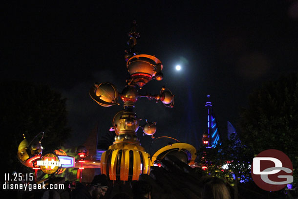 A full moon over the entrance to Tomorrowland