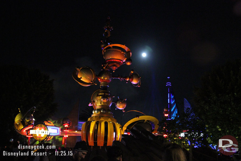 A full moon over the entrance to Tomorrowland