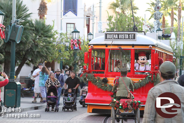 The Red Car traveling through the park.