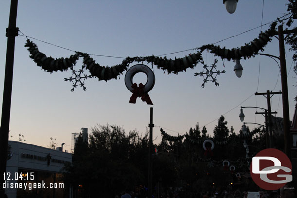 Passed through Cars Land.  The lights were not on yet and a CM said not until after 5.