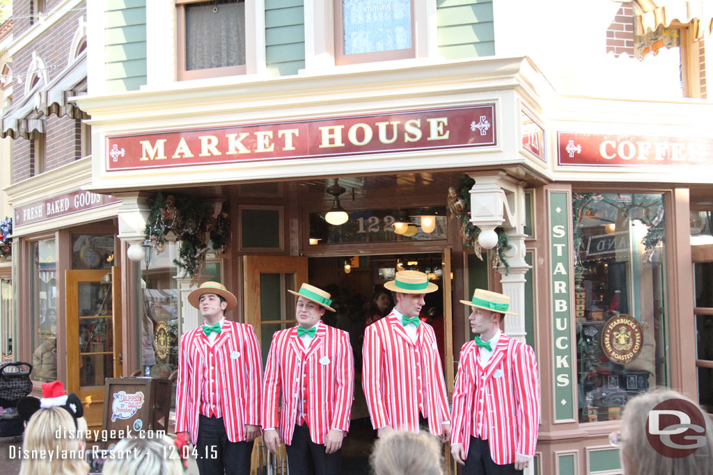 The Dapper Dans of Disneyland performing in front of the Market House