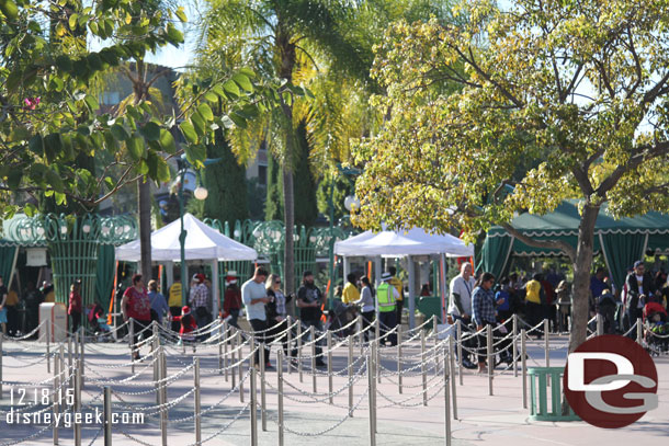 A wider shot of the entrance.  The white tents are the new metal detectors.  There were a lot of security castmembers, police, and contractors as you entered.  This was true for all entry points.