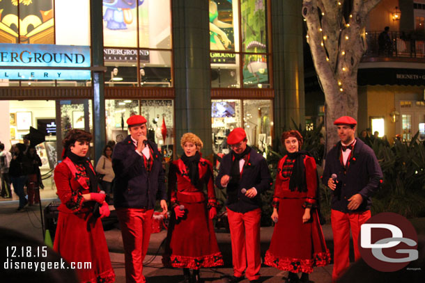 A group of Carolers performing (the website lists sets at the top of the hour but they performed at 8:30).