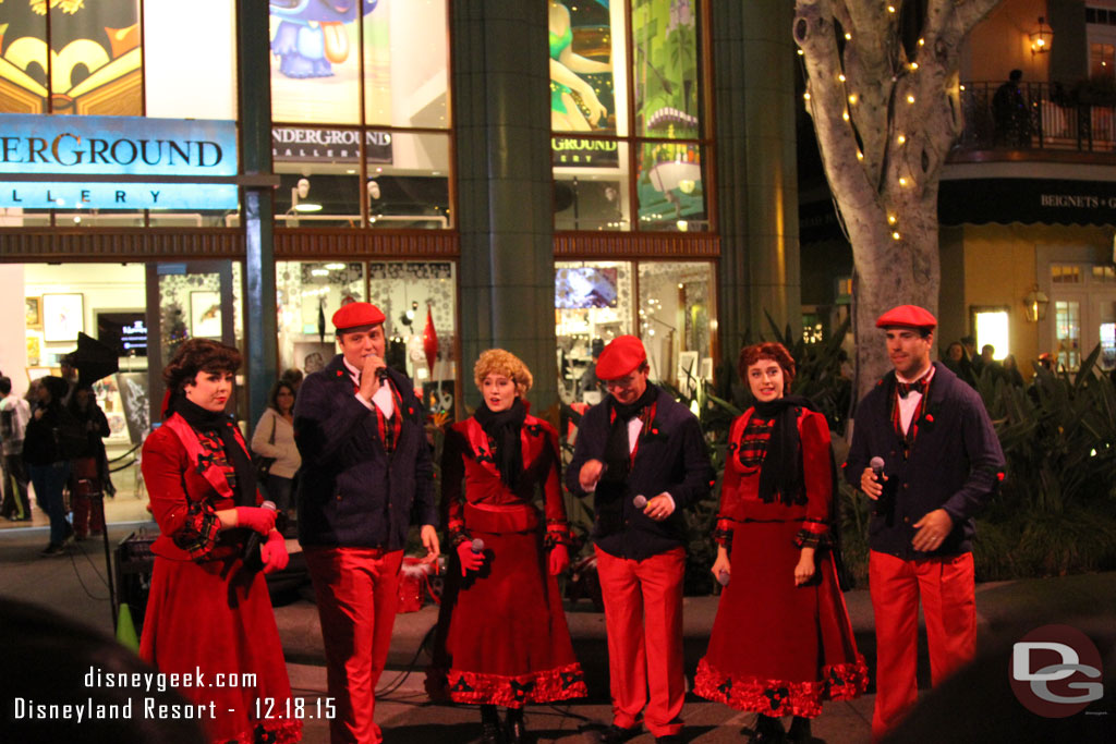 A group of Carolers performing (the website lists sets at the top of the hour but they performed at 8:30).