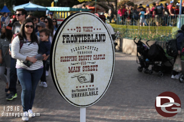 A sign in Fantasyland to help you find Frontierland.