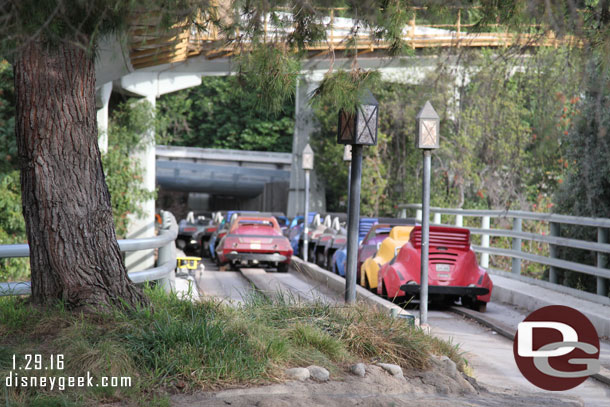 Cars parked out on the bridge area.