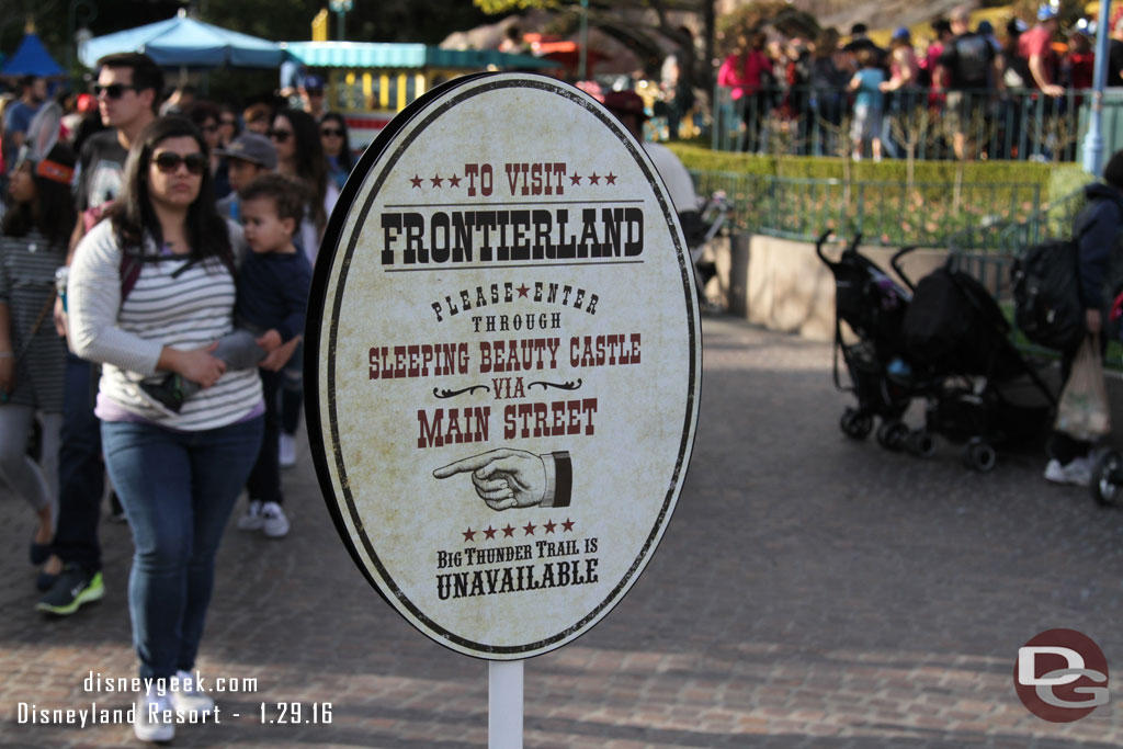 A sign in Fantasyland to help you find Frontierland.