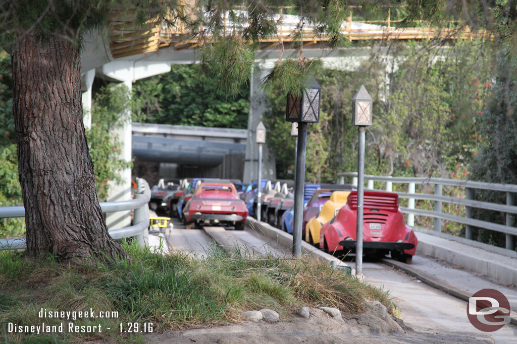 Cars parked out on the bridge area.